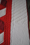 White border with angled white strips of fabric to create quilted design