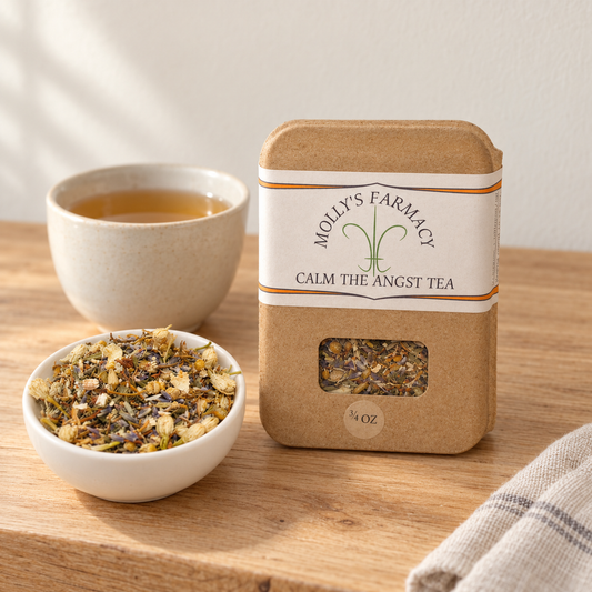 Molly's Farmacy Calm The Angst Tea, 3/4 oz, beside loose tea and a cup. Styled scene based on the genuine product photo.