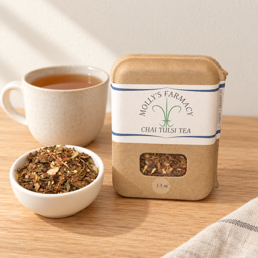 Molly's Farmacy Chai Tulsi Tea, 1.5 oz, beside loose tea and a cup. Styled scene based on the genuine product photo.