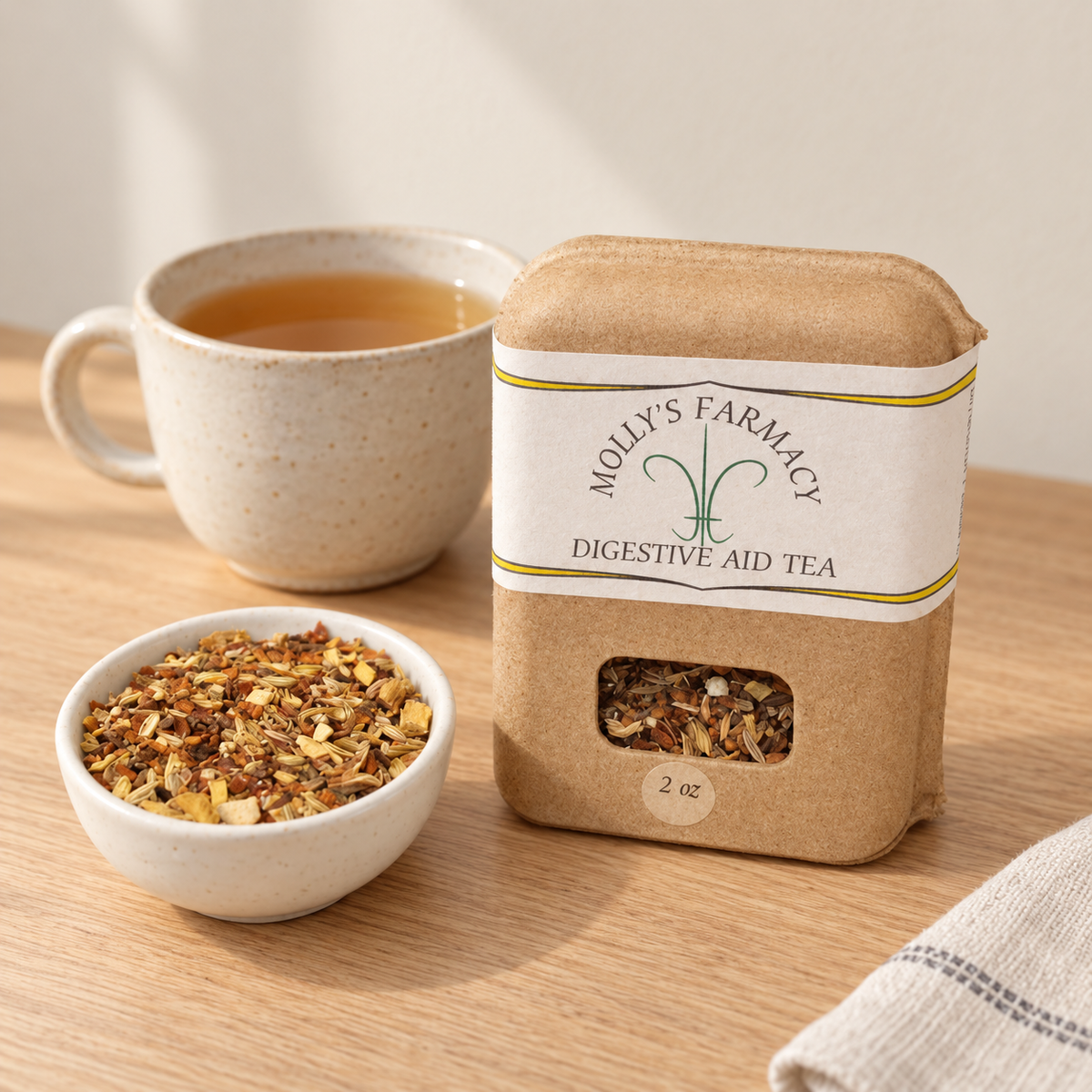 Molly's Farmacy Digestive Aid Tea, 2 oz, beside loose tea and a cup. Styled scene based on the genuine product photo.