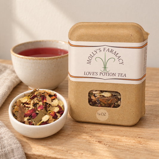 Molly's Farmacy Love's Potion Tea, 3/4 oz, beside loose tea and a cup. Styled scene based on the genuine product photo.