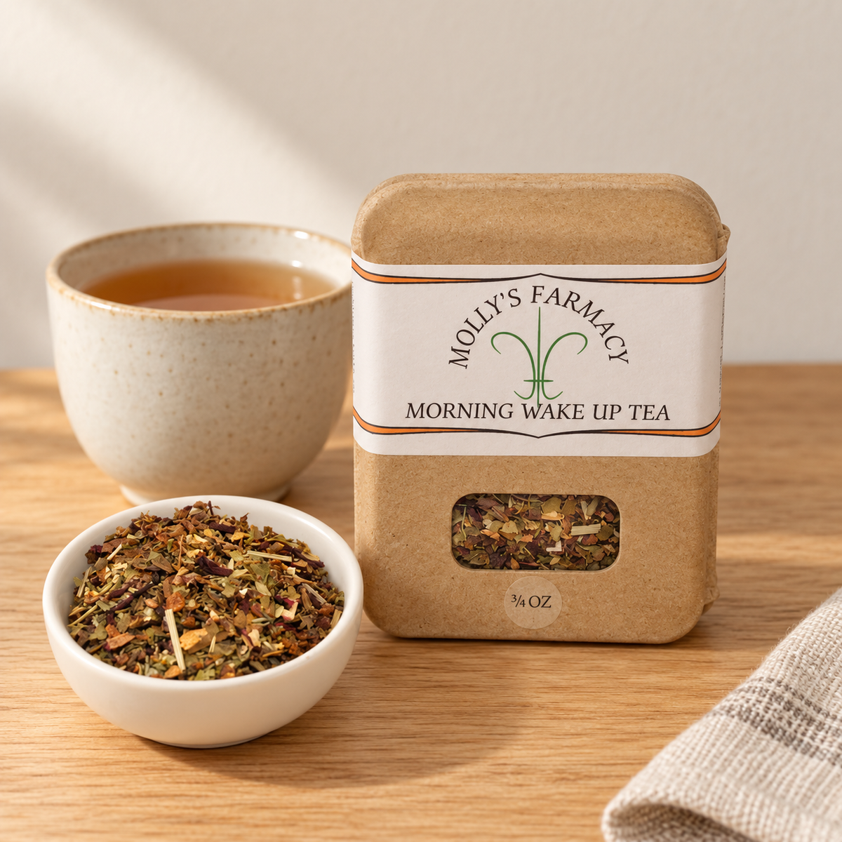 Molly's Farmacy Morning Wake Up Tea, 3/4 oz, beside loose tea and a cup. Styled scene based on the genuine product photo.