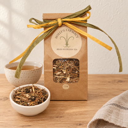 Molly's Farmacy Brain Nutrition Tea, 3 oz, beside loose tea and a cup. Styled scene based on the genuine product photo.
