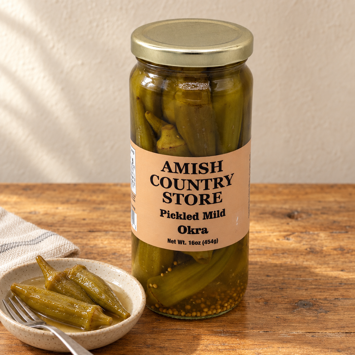 Old-Fashioned Mild Pickled Okra (16oz); 16 oz package shown beside a serving.
