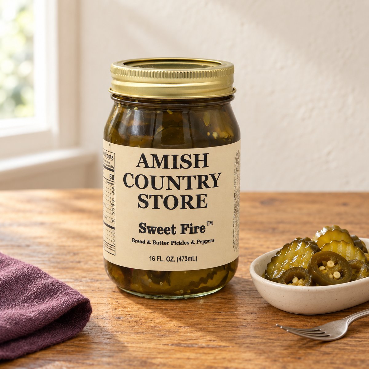 Amish Country Store Sweet Fire Bread & Butter Pickles & Peppers, 16 fl oz jar, with pickled cucumber slices and jalapeño rings.