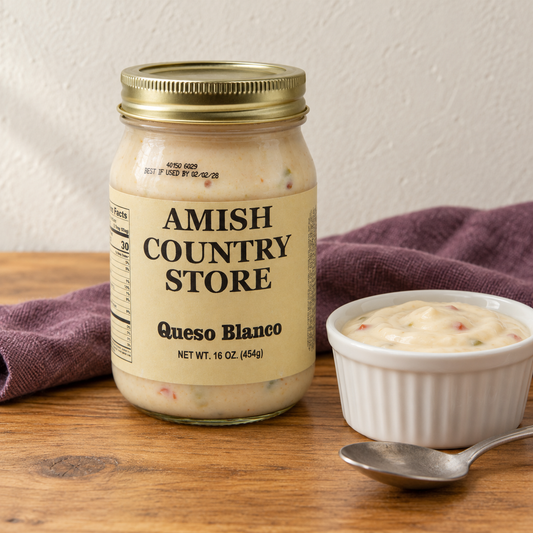 Amish Country Store Queso Blanco,16oz jar beside ivory white cheese dip.
