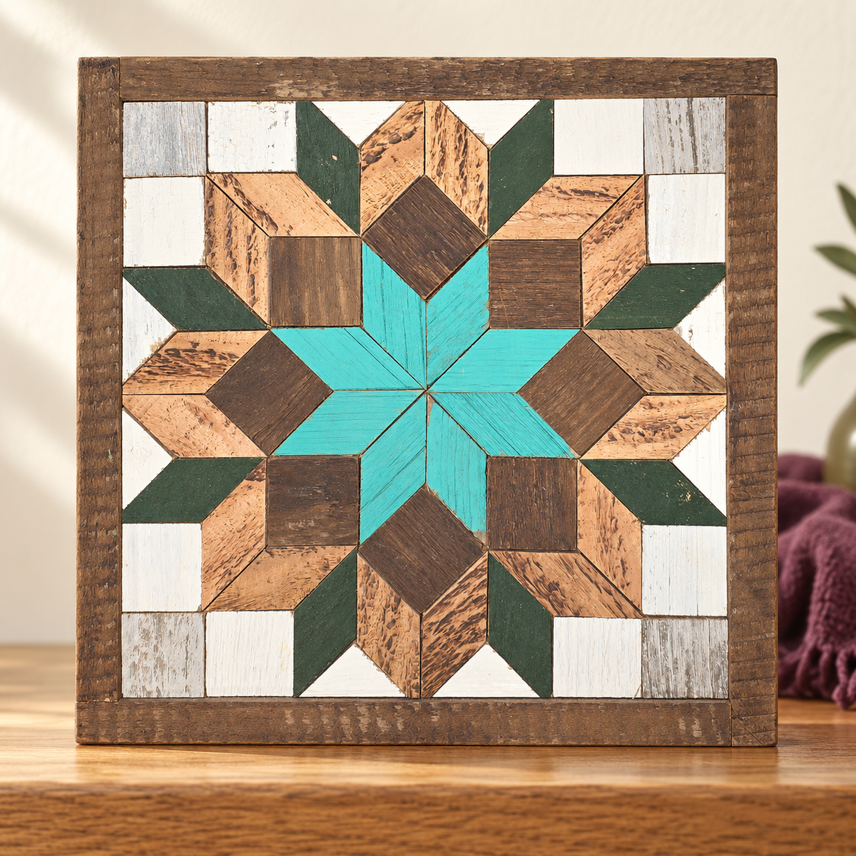 Green and Turquoise 10.5-inch Amish barn quilt displayed on a warm wood console against an ivory wall.