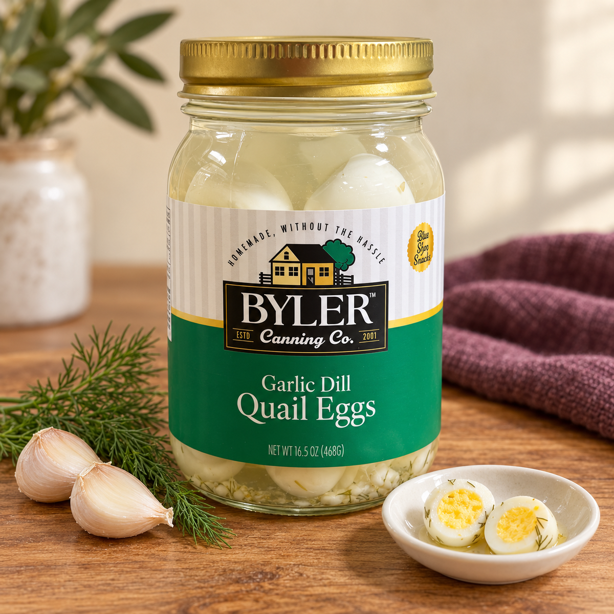 Byler Garlic Dill Pickled Quail Eggs | 16.5 oz in its original jar with a serving suggestion.