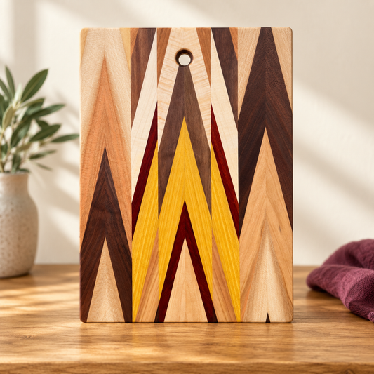 Amish-made chevron inlay cutting board with its natural multicolor wood pattern.