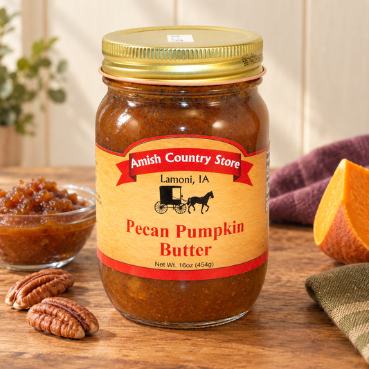 Amish Country Store Pecan Pumpkin Butter Net Wt 16oz (454g) jar with a small serving and ingredient cues.