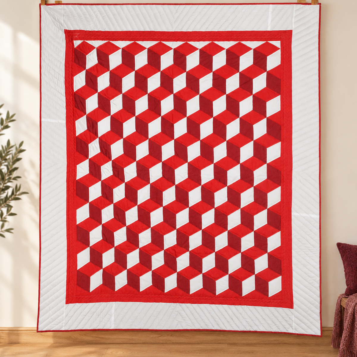 Amish handstitched red, burgundy, and white tumbling-block quilt with white border.