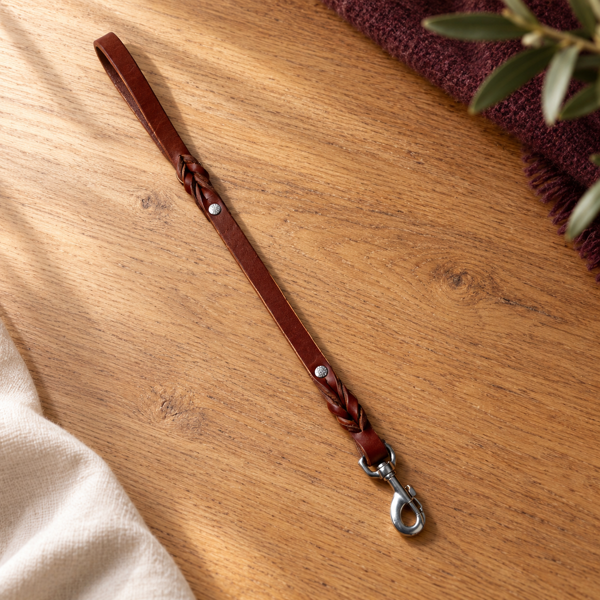Amish-made short 19-inch brown leather dog leash with metal clasp.