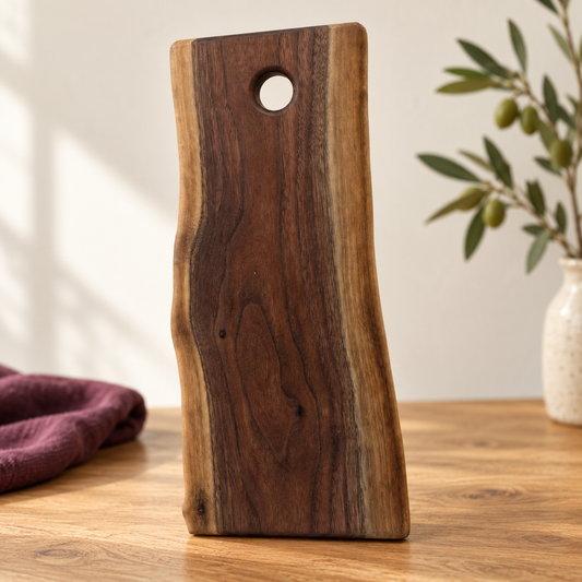 Extra-small Amish-made live-edge cutting board with natural grain and hanging hole.
