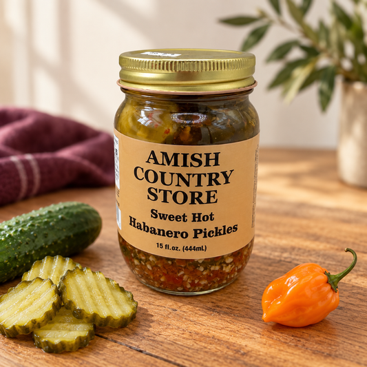 Sweet Hot Habanero Pickles, 15 fl oz jar, with sliced cucumber and orange habanero.