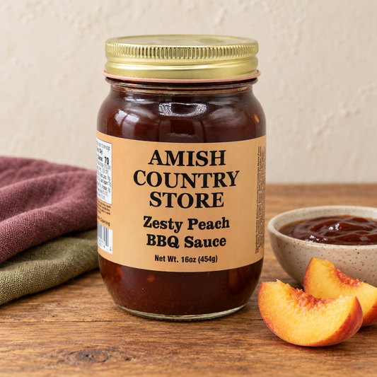 Amish Country Store Zesty Peach BBQ Sauce, 16 oz jar beside a serving of sauce