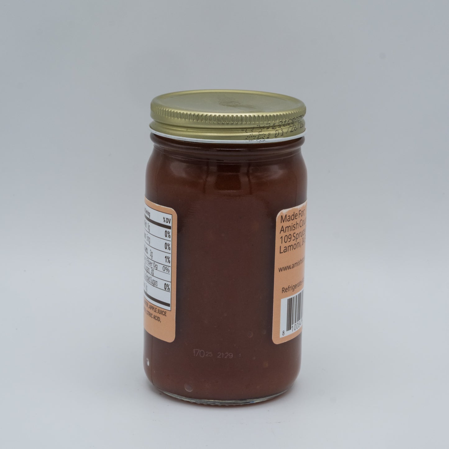 Jar of chocolate spread with a label on a white background