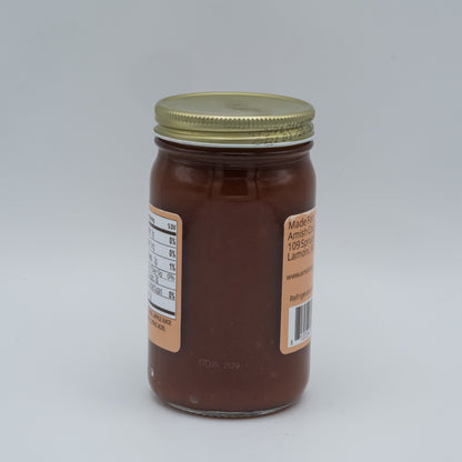 Jar of chocolate spread with a label on a white background