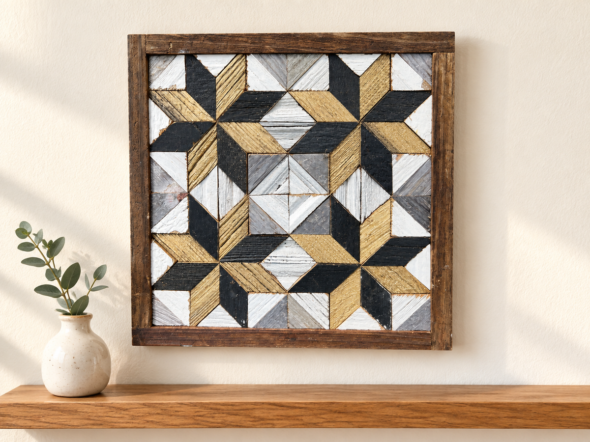 S1143 — small wooden barn quilt wall art, gold and charcoal corner stars with white diamond center, displayed on an indoor wall in a styled home