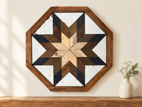 S812 — small wooden barn quilt wall art, octagonal with natural wood center, brown and black outer starburst, displayed on an indoor wall in a styled home