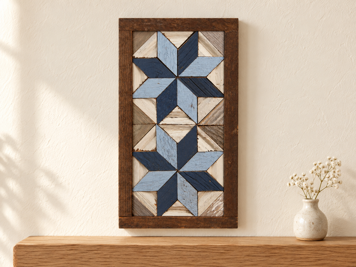 S9 — small horizontal two-star wooden barn quilt wall art, light blue and navy stars on white triangles, displayed on an indoor wall in a styled home