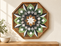 S1189 — wooden barn quilt wall art, OCTAGONAL eight-sided quilt with green, sage, charcoal, gray and white geometric flower, white center star, shown on an indoor wall in a styled home display