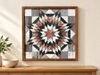 S1196 — wooden barn quilt wall art, square dusty rose, charcoal and white layered starburst, shown on an indoor wall in a styled home display