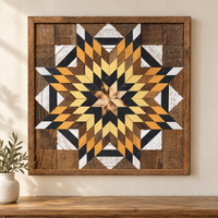 S1237 — Amish reclaimed wood barn quilt wall art, square ochre-orange, yellow, charcoal and natural brown layered starburst with honey wood center and white accents, displayed on an indoor wall above an oak console
