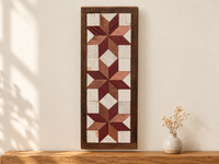 S10 — horizontal three-star wooden barn quilt wall art, three burgundy and copper rose stars on ivory squares, displayed on an indoor wall in a styled home