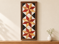 S9 — horizontal three-star wooden barn quilt wall art, three bright red and honey wood stars on black and white triangles, displayed on an indoor wall in a styled home