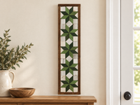 S12 — vertical five-star wooden barn quilt wall art, five light-green and dark-green stars on ivory squares, displayed beside an entryway