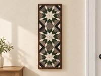 S1216 — tall wooden barn quilt banner wall art, three white center stars, forest green middle points, white tips, gray field and black diagonals, displayed on an indoor wall in a styled home