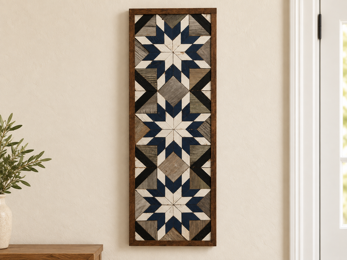 S1220 — tall wooden barn quilt banner wall art, three white center stars, navy blue rings, white tips, gray field and black diagonals, displayed on an indoor wall in a styled home