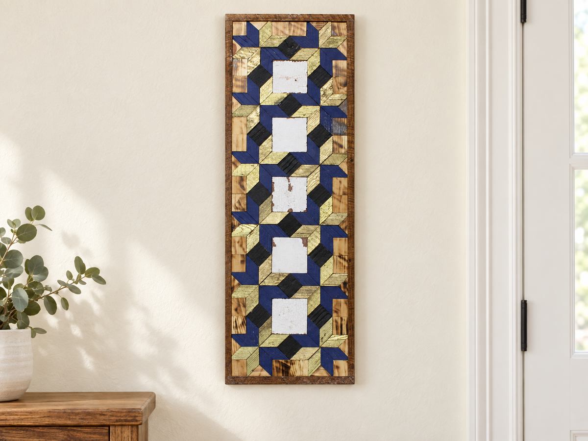 S647 — tall wooden barn quilt banner wall art, five white square centers linked by navy and gold geometric rings and black diamonds, displayed on an indoor wall in a styled home