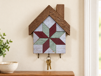 KH-08 — house-shaped wooden barn quilt key holder with exactly three existing metal hooks, KH-08 Burgundy & Sage, displayed beside an entryway