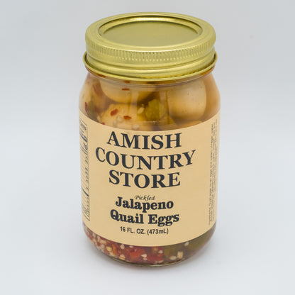 Jar of Amish Country Store jalapeno quail eggs on a white background