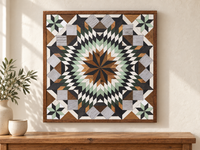 S1208 — 30.5 inch Amish reclaimed wood barn quilt mint green, forest green, charcoal, white and natural wood layered starburst and four mint-and-black corner stars, displayed above a console