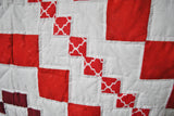 Red and white border that separates each square and set of diamond designs